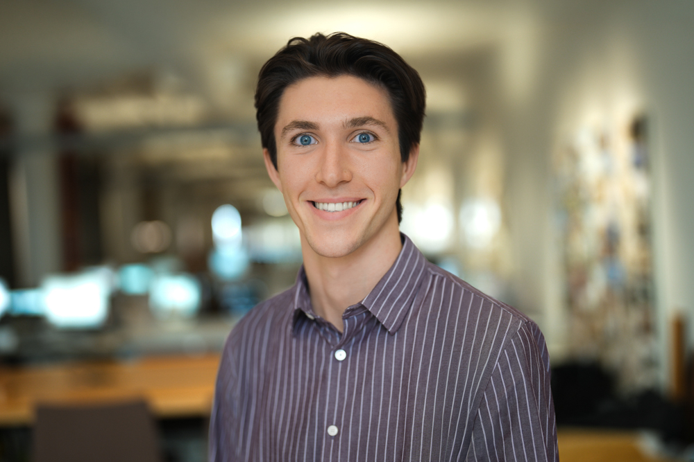 Employee in a striped shirt photographed inside a New York City office