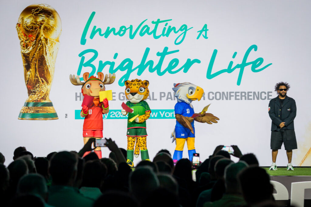 FIFA mascots appearing on stage during the Hisense conference in New York