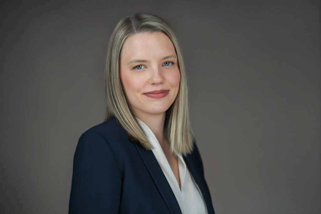 Professional woman with a composed neutral expression during a headshot session in Bergen County NJ