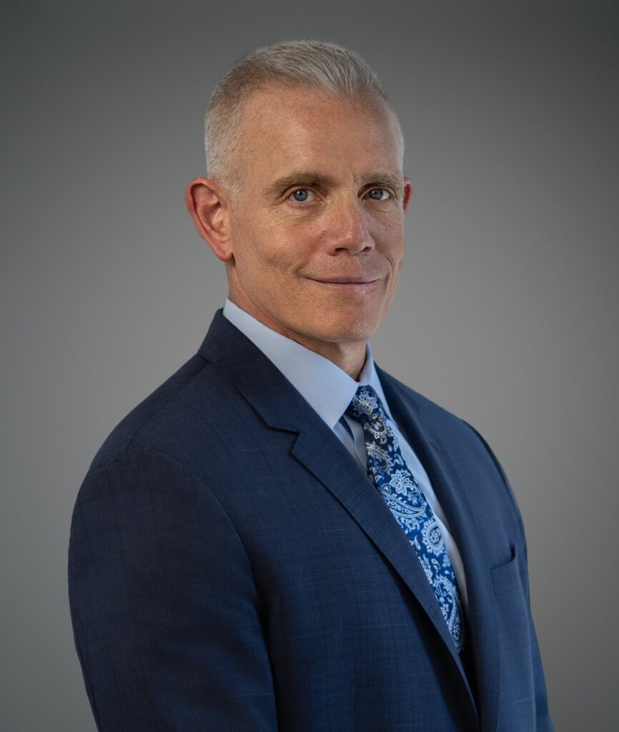 Male executive holding a slight body angle during a professional headshot session in New Jersey