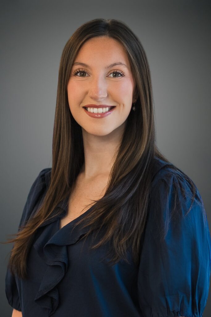 Female professional holding a head and shoulders pose during a headshot session in New Jersey