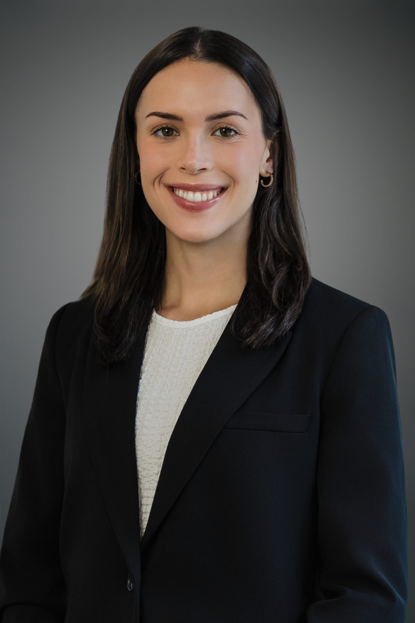 Professional woman with a confident natural smile during a headshot session in a New Jersey studio