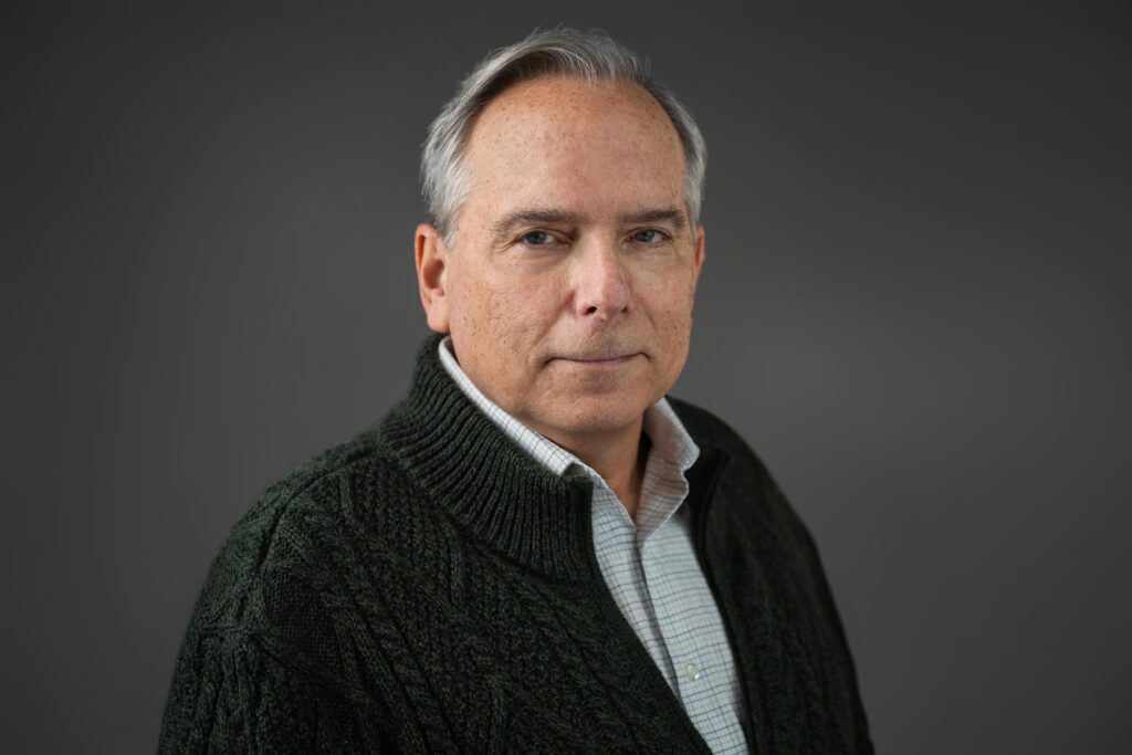 Actor in knit sweater photographed for grounded mature casting read at NJ headshot studio