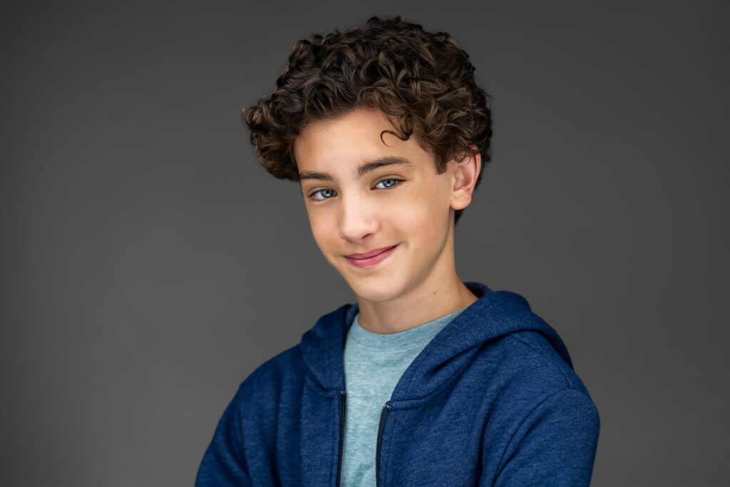 Young actor in a casual hoodie during an actor headshot session in New Milford NJ
