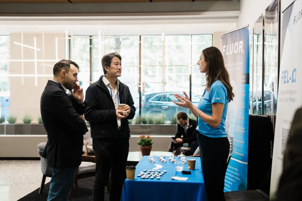 Business professionals networking at the FOAK Summit