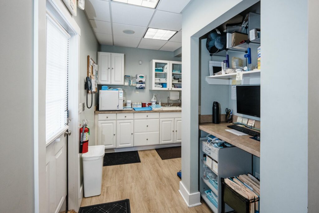 White cabinetry and counter detail inside a dental practice photographed in Manasquan, New Jersey
