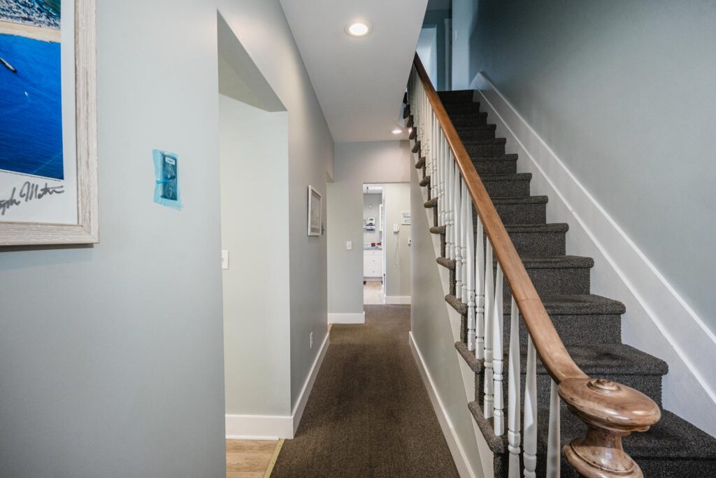 Interior hallway and staircase of a Manasquan, New Jersey dental office photographed by Alex Kaplan