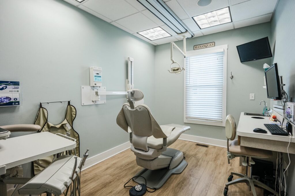 Treatment room with window light and cabinetry photographed inside a Manasquan dental office