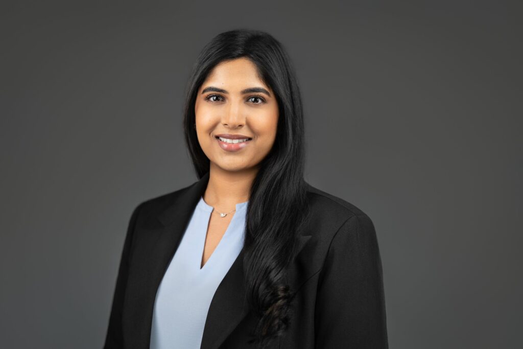Professional headshot of woman in black blazer photographed by Alex Kaplan